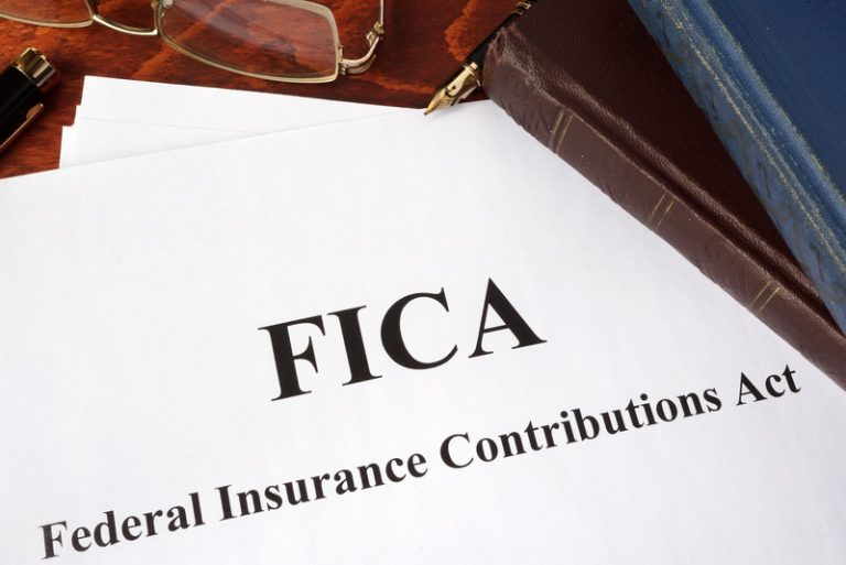 Papers with FICA Federal Insurance Contributions Act tax.