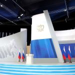 empty stage with flags and podium