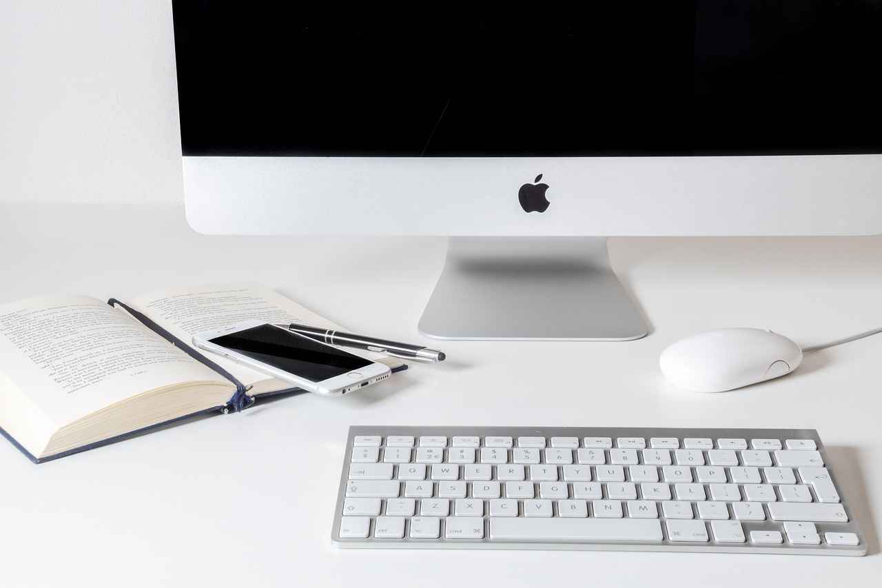 Work, computer, apple — Simplify Travel Transactions with Reliable Merchant Accounts