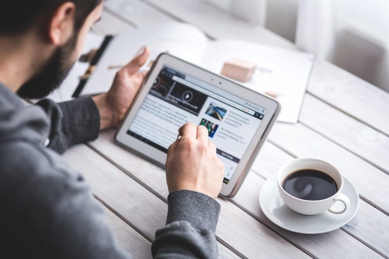 Man, reading, touchscreen — Why Sydney Consumers Prefer Reliable Nang Delivery Platforms: Trends, Statistics & Service Insigh